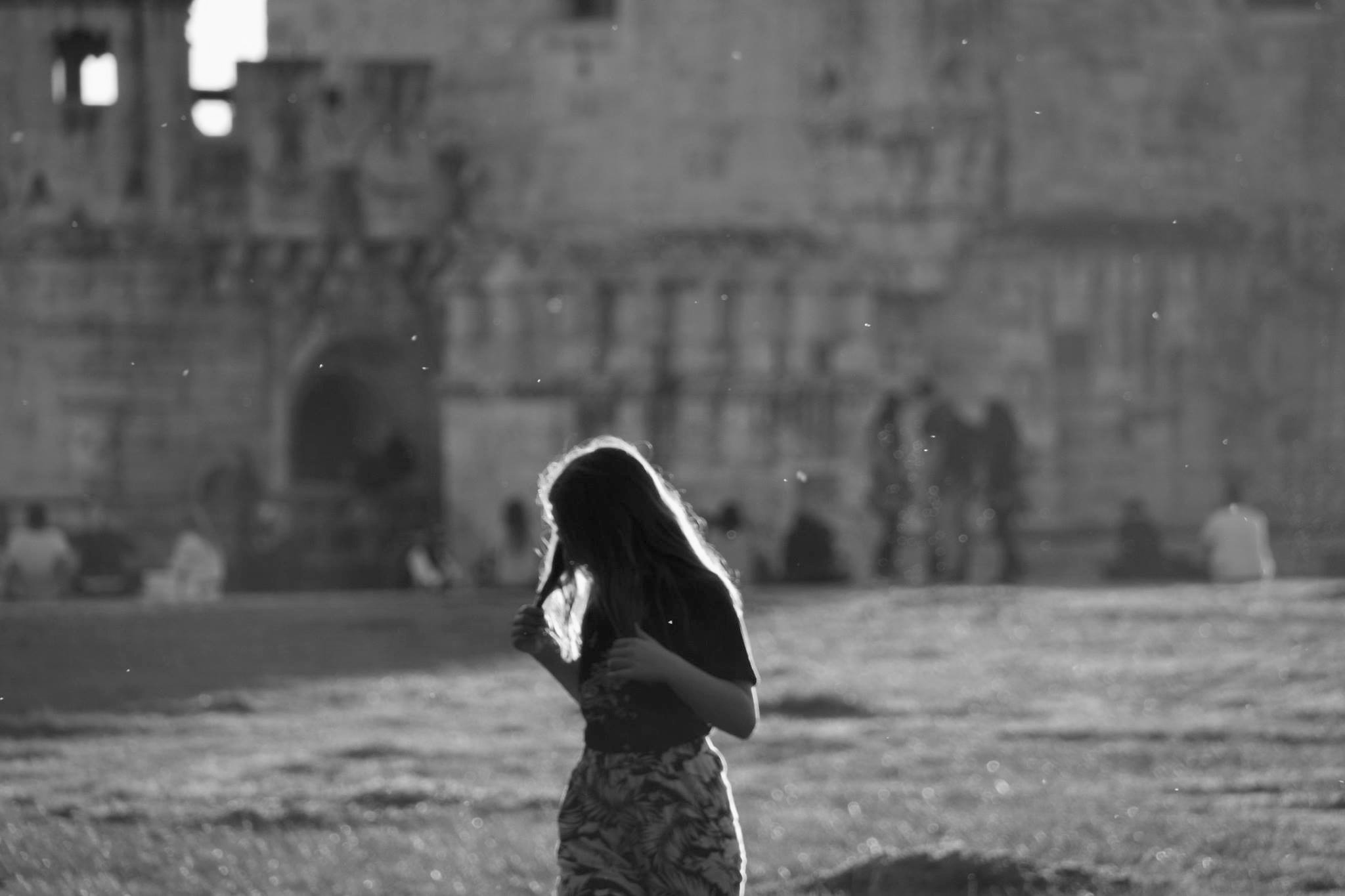 girl walking, black and white photo.